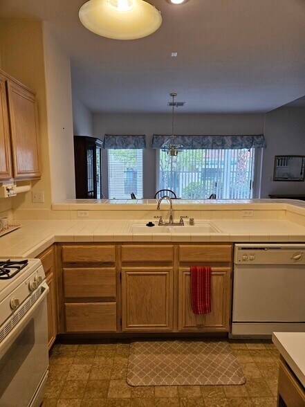 Kitchen looking towards patio - 5252 Sunny Beach Ln