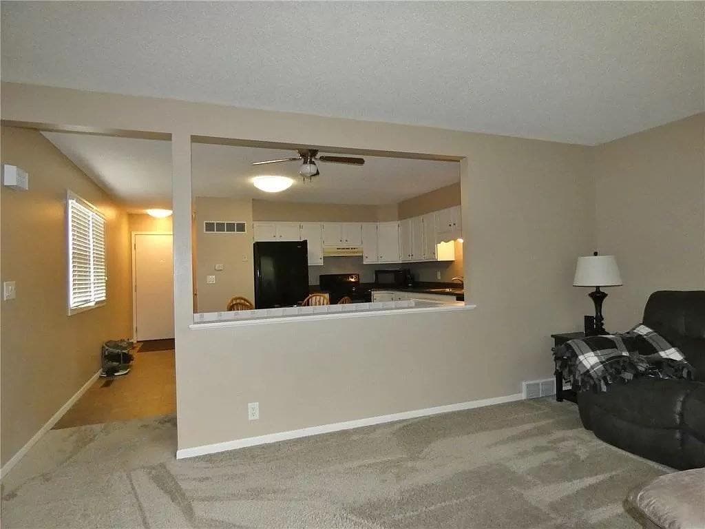 Living Room into Kitchen - 77 Brook Cir
