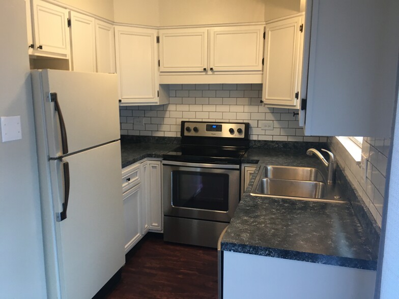 Kitchen with stainless appliances and subway tile - 4715 SE Adams Blvd
