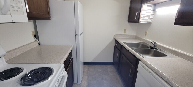 Building Photo - Upper 2 Bedroom Apartment – Heat Included - Available: First Week of June  2026