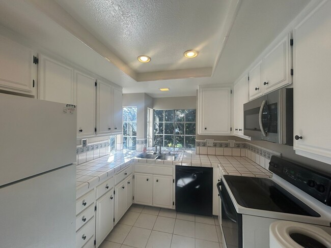 Building Photo - Upper-Level Condo – Bright, Stylish, and Ideally Located!