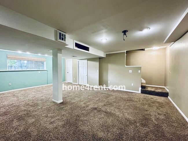 Building Photo - Blue Valley Schools w/ Wood Floors, Finished Basement and a Peaceful, Private Fenced Yard!