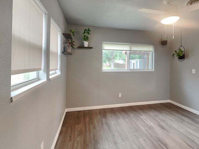 Building Photo - Front Porch Charm & Backyard Dreams!