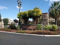Building Photo - Gated Community Stunner ready to be called...