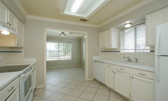 Building Photo - 4 Bedroom 2 Bathroom Cypress Home with Fireplace and Fenced Backyard