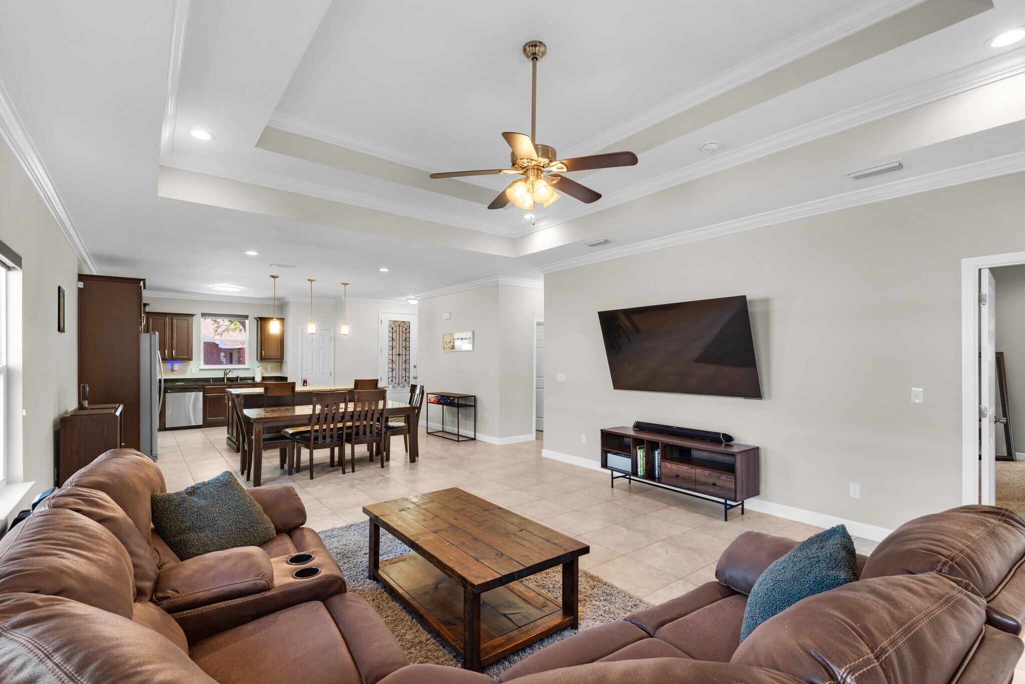 Living room has a huge TV, surround sound, blackout shades, and huge couch - 28 Snook Rd