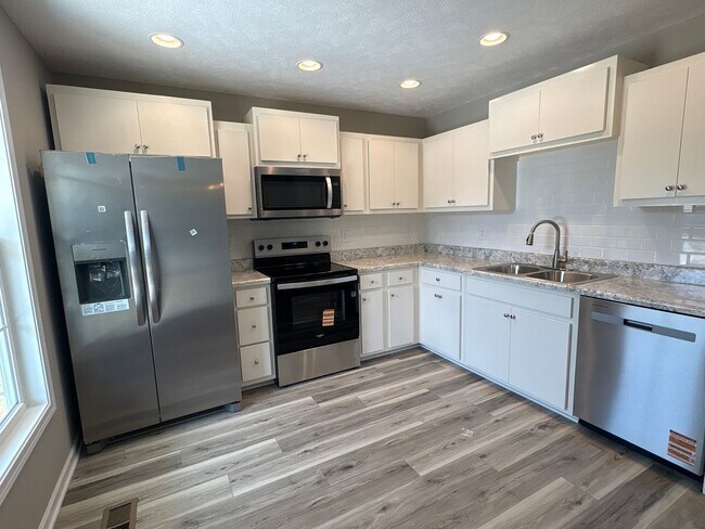 Building Photo - Charming New Home with a Rocking Chair Front Porch!