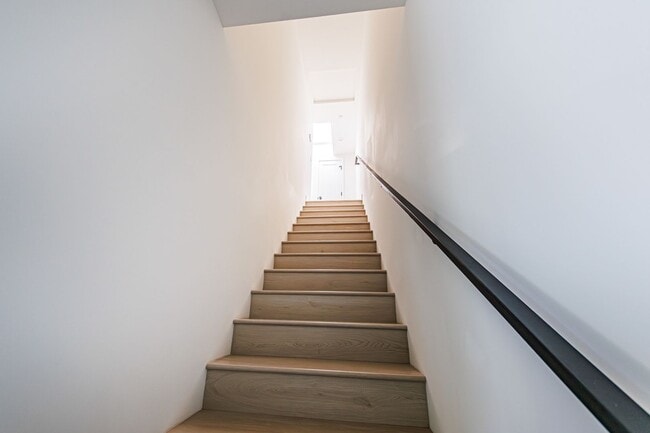 Building Photo - Modern 4-Bedroom Townhome-Style Living in ...
