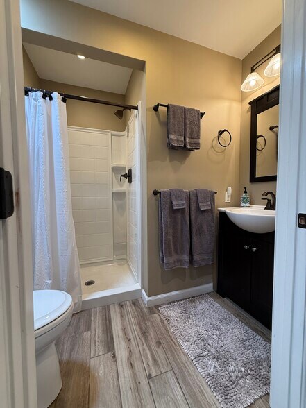 Second Full Bathroom with Step-In Shower and Storage Cabinets - 1507 San Jose St