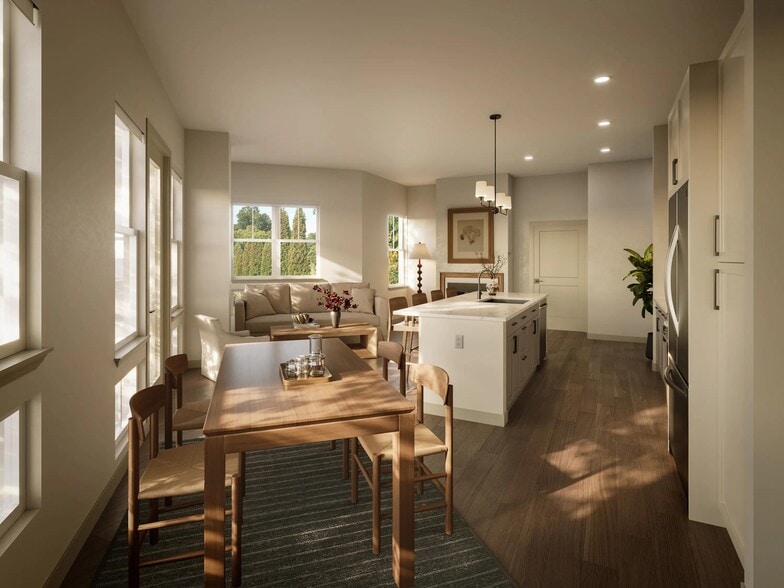 Open-concept kitchen and dining area with clean-lined finishes, a generous island, and natural light shaping everyday gathering spaces. - Modera Weston