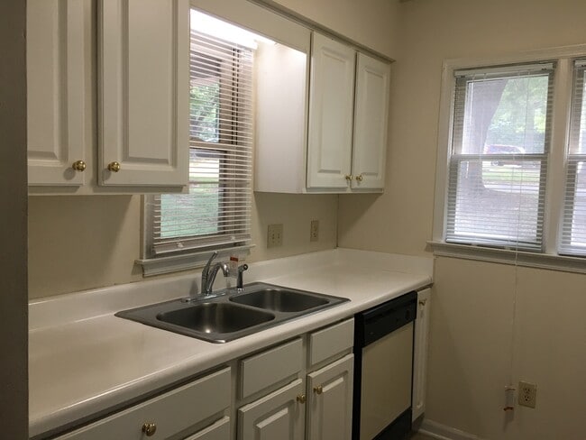 Building Photo - ONE LEVEL CONDO NEAR REX HOSPITAL -Firepla...