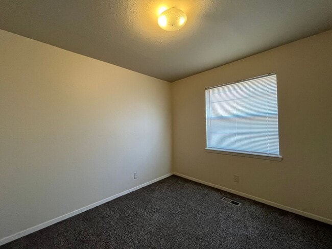 Building Photo - Sheridan Duplexes 01-03