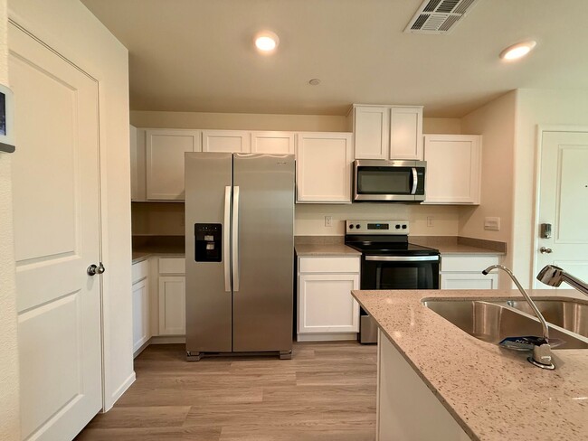 Building Photo - Brand-New Townhome for Rent in the Highly ...