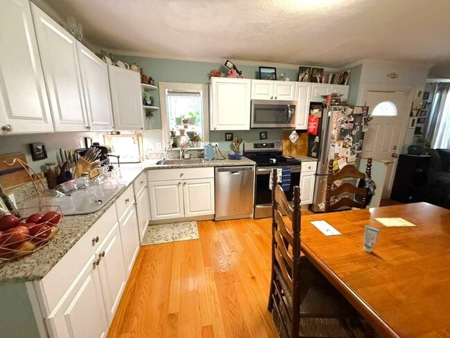 Building Photo - Spacious and updated 3-bedroom condo just 2 blocks from Airport T Station!