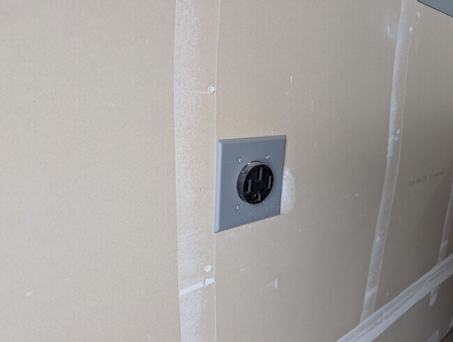 Building Photo - New Wilson home offering modern amenities, solar and a nice floor plan. Bonus room with den or of...