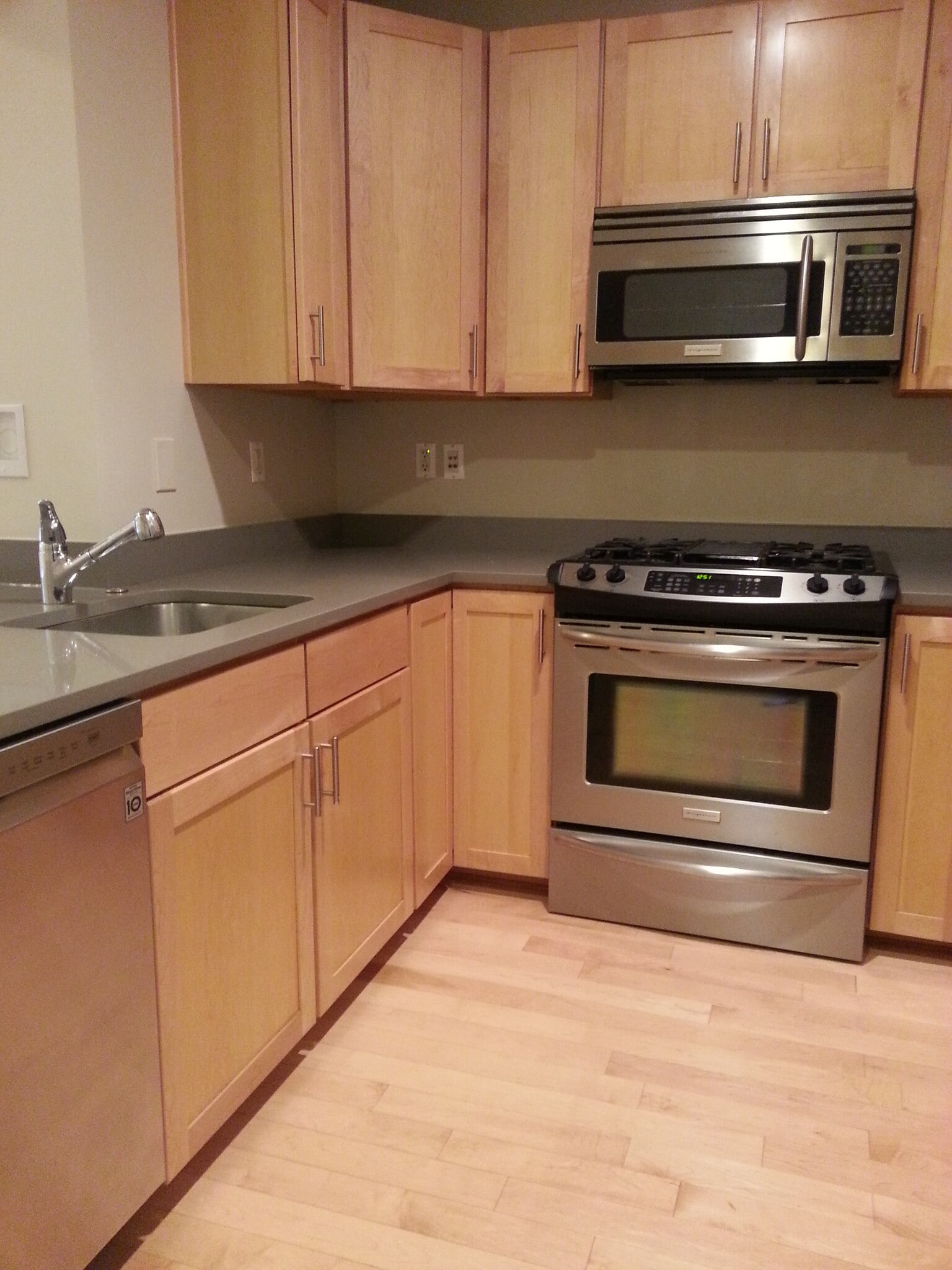 Full-size oven and range, over-the-range microwave, large fridge, and dishwasher - 1123 6th St NW
