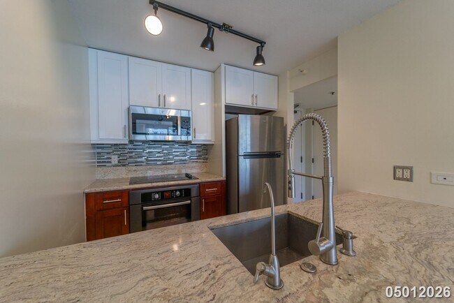 Building Photo - Luxury 1-Bedroom Condo with Stunning Mountain Views