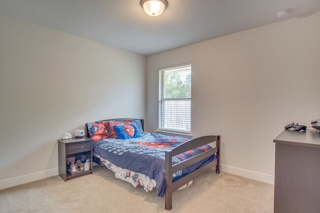 Building Photo - Spacious 4BR/2BA Brick Home with 2-Car Garage, Granite Kitchen, Vaulted Ceilings & Fully Fenced B...
