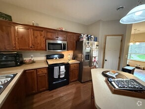 Building Photo - Roomy four-bed three-bath + loft townhome ...