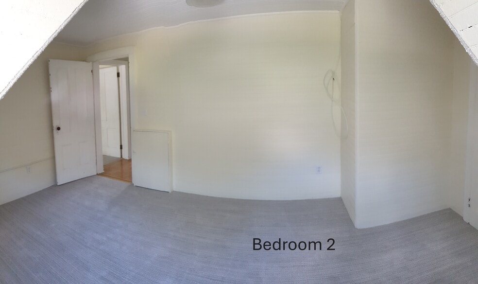 Comfortable second bedroom with fresh carpet, bright walls, and a roomy closet - 412 Morris Ave