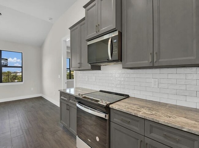 Building Photo - Almost New Construction Waterfront Home in NE Cape Featuring A Pool, Fenced Yard & More! COMING SOON