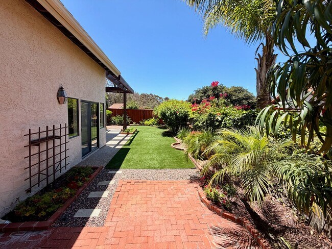 Building Photo - Private Oasis with Sunroom, Balcony & Lush Landscaping | 4BR Home Near Community Pool & Spa