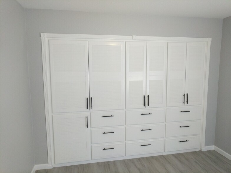 Room 2 - with custom built in cabinet and dresser. South Wall - 14101 N 78th Dr