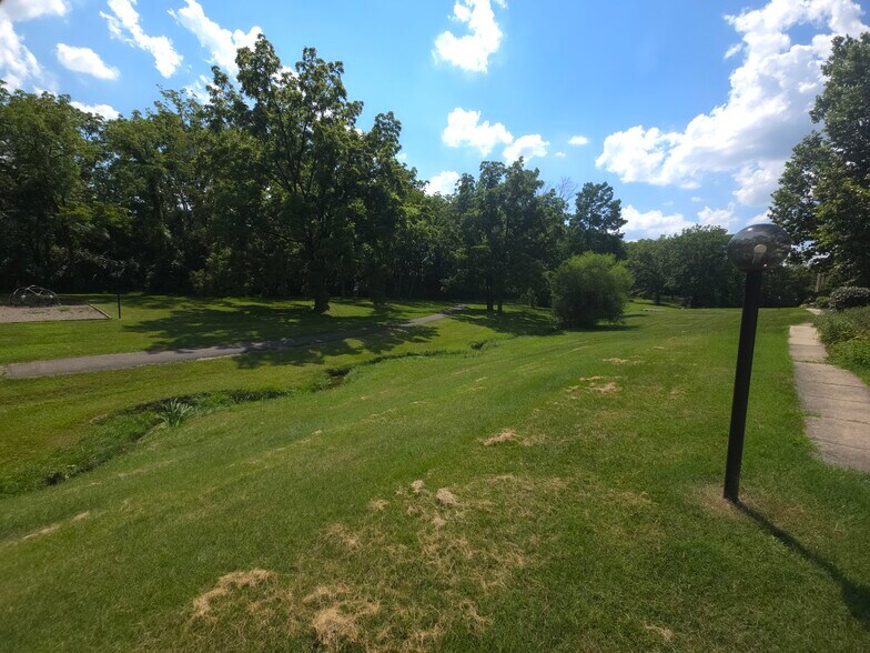 Partially wooded community greenspace - 7618 Thames Ct