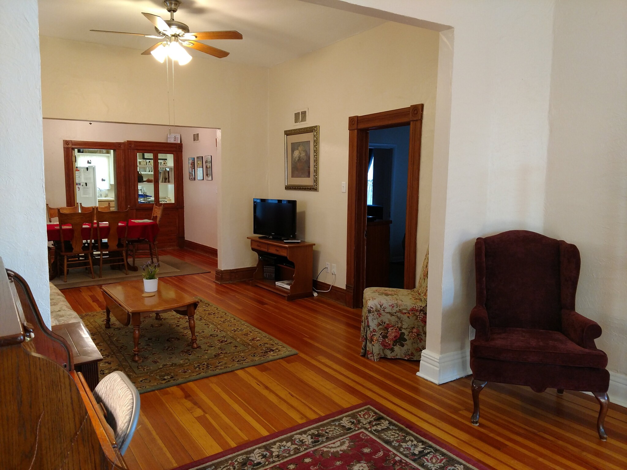 View of main living room with door to middle bedroom (furnishings not included with rental) - 607 Harrison Ave