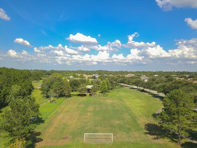 Building Photo - MOVE IN SPECIAL- Charming 3/2 home w/ formal office/4th bedroom and fenced yard in Harmony