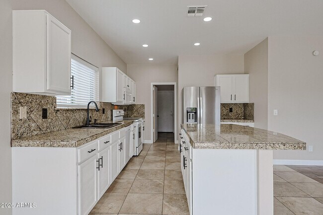 Building Photo - 15569 W Gelding Dr