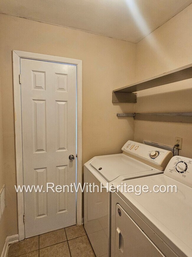 Building Photo - Great Brick Ranch / Harwood Floors / Huge Shop or Extra Storage / No Garage / Great Private Back ...