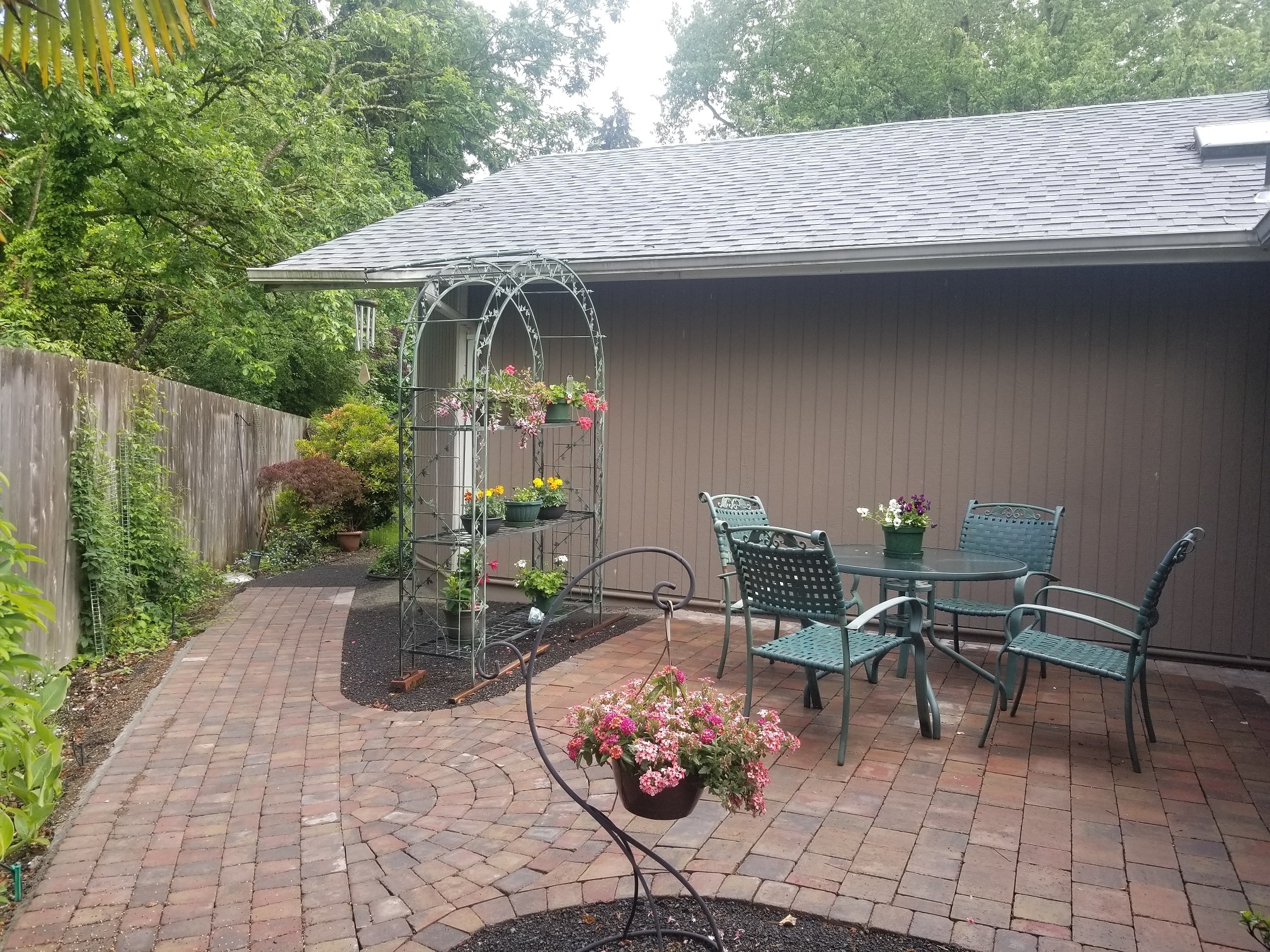 View of the patio with custom pavers; furniture shown in this photo belongs to previous tenants - 885 Randall St