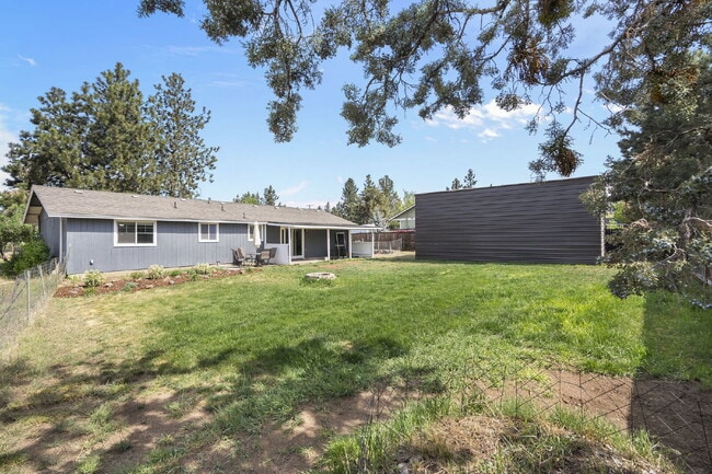 Building Photo - Charming 3-Bedroom Bend Home on 1/2 Acre with Expansive Yard, Mature Trees & Covered RV/Boat Storage