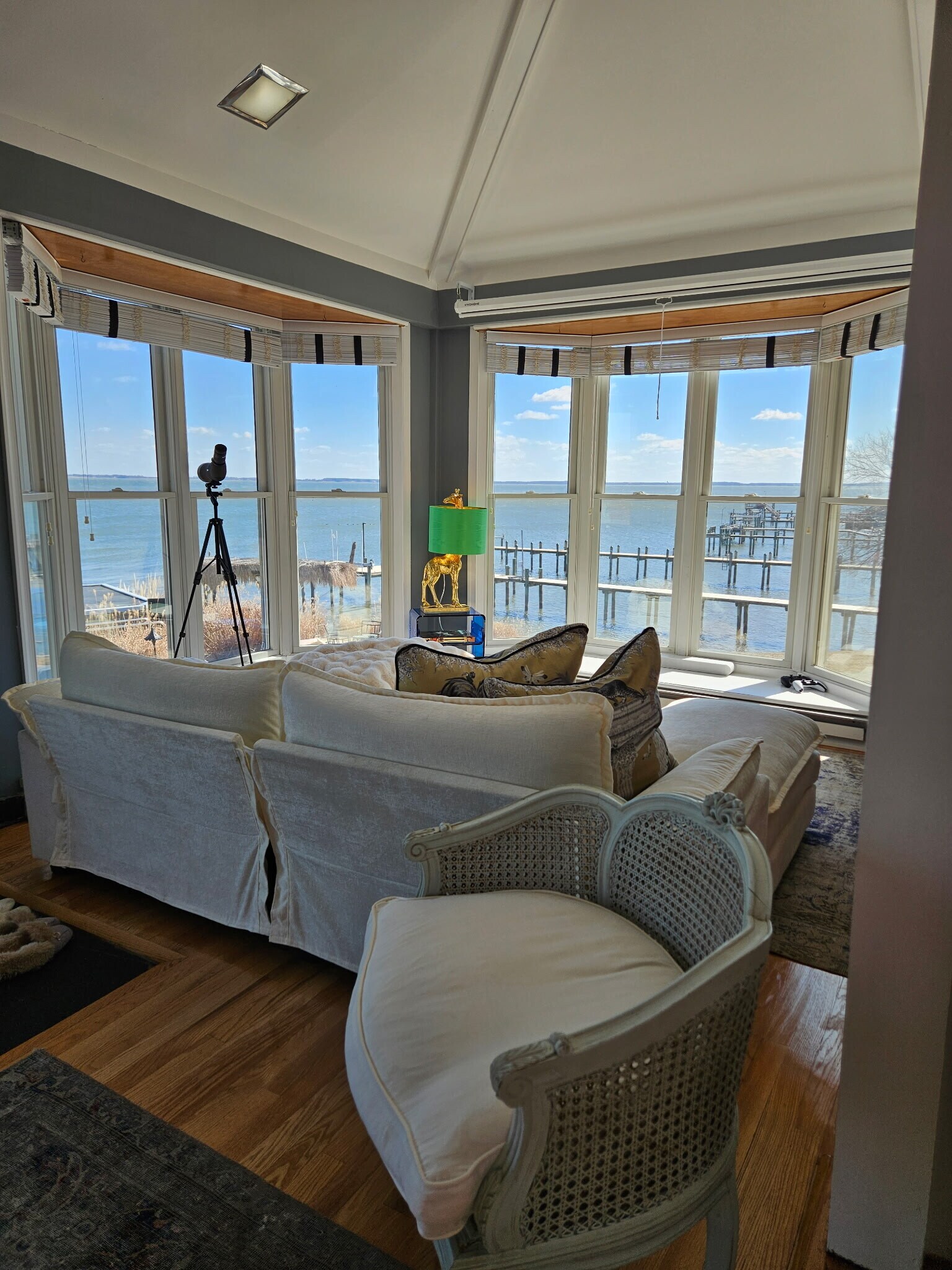 Family room furnished with 8-foot pulldown movie screen above window - 1301 Rogers Rd