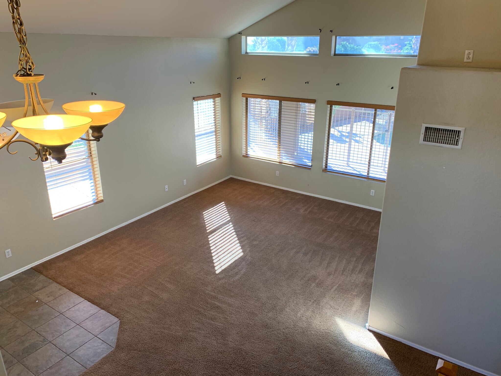Spacious 4-bedroom, 2-bath home with soaring ceilings, gourmet kitchen, and a heated self-cleaning p - 16426 N 152nd Ln