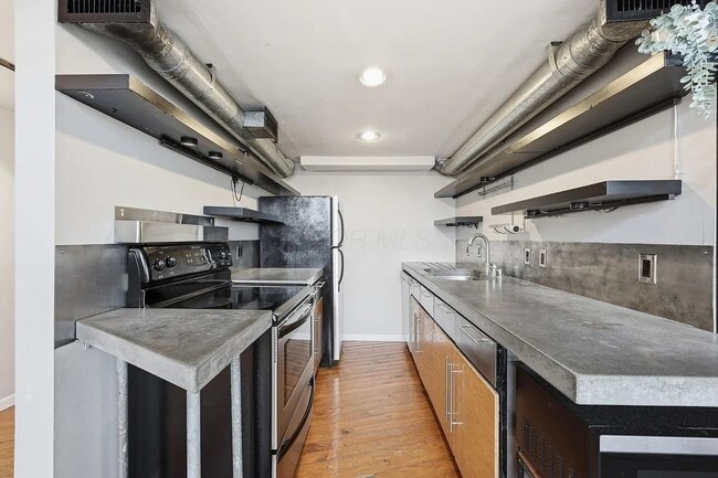 Building Photo - Industrial NYC-Style Loft | Battleship Building | 3 Parking Spots Included