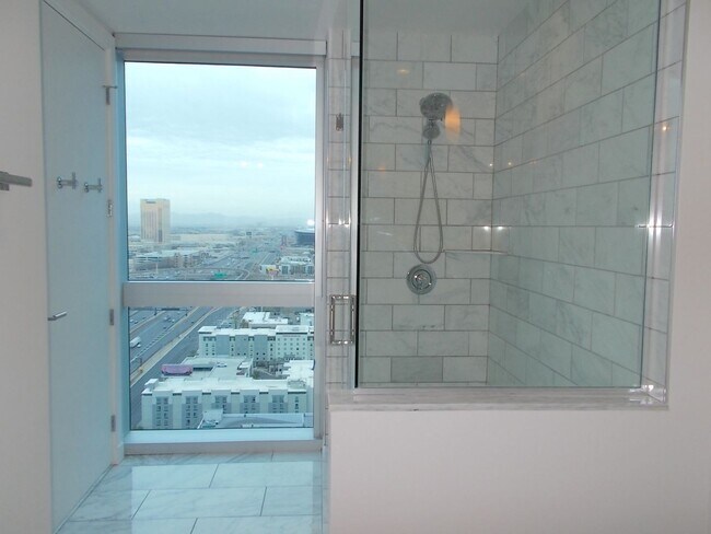 Building Photo - Experience elevated high-rise living at The Martin.