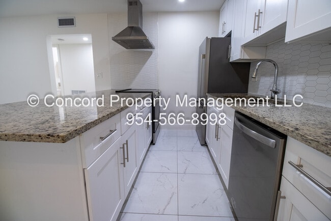 Building Photo - Holiday Special-Updated 2 BR- Open Layout- Island Kitchen-Pool- Central AC