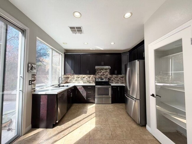 Building Photo - Wonderful corner lot home features 4 bedrooms and 3 full bathrooms