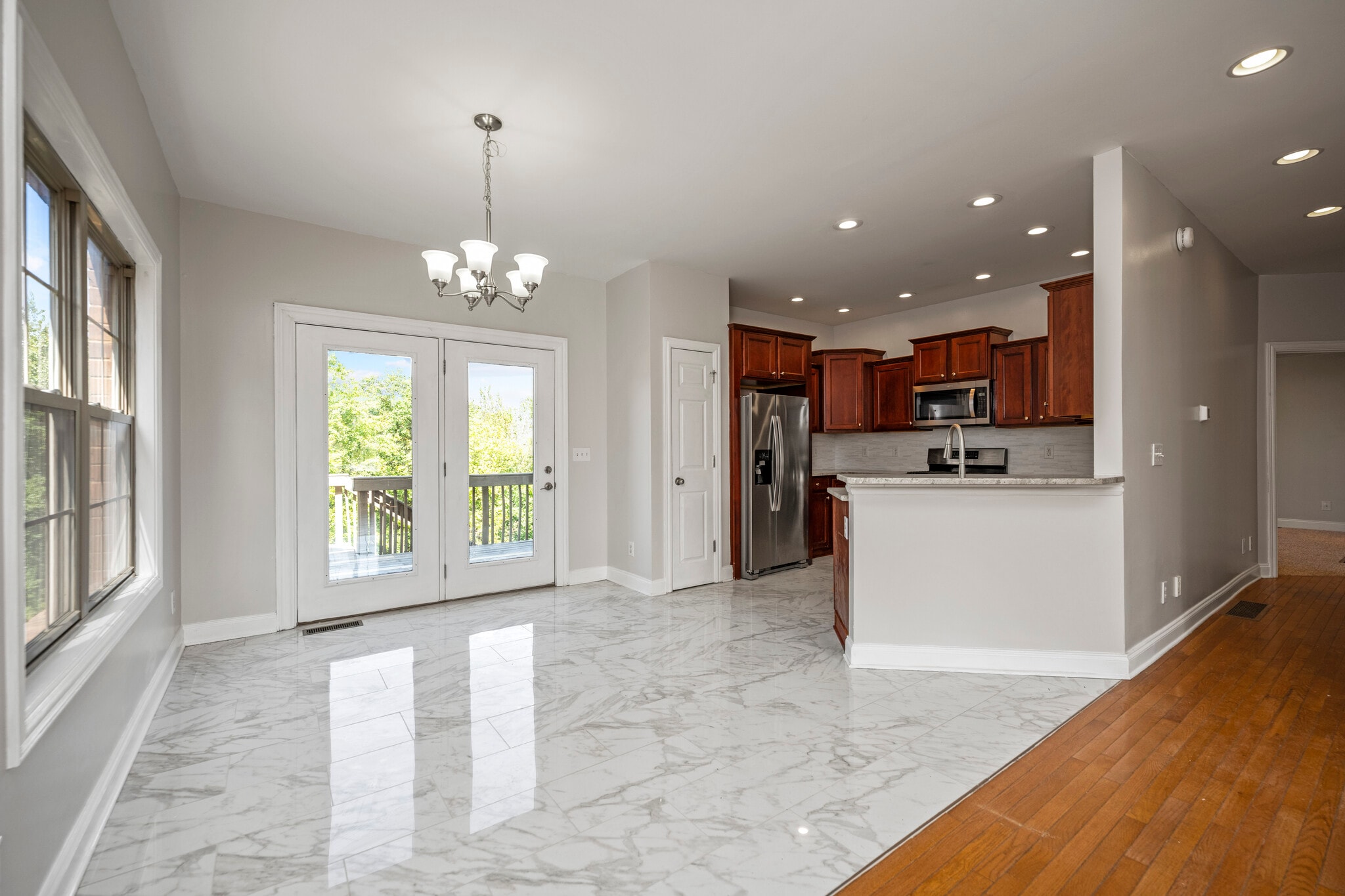 Looking from Family Room into the Dining Area, Rear Door to the Deck and Kitchen - 393 Hays Blvd