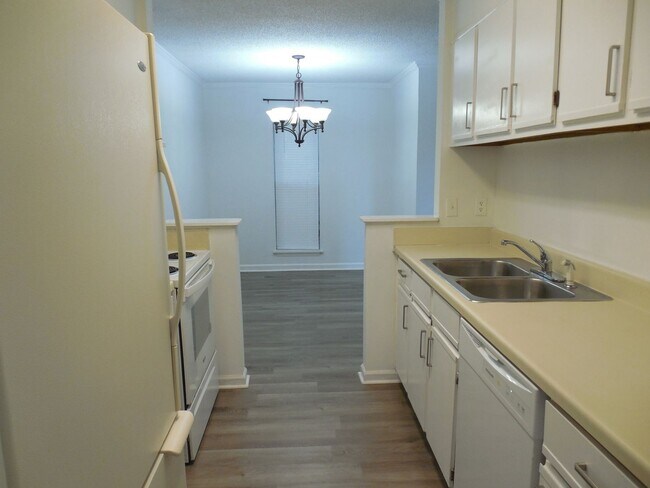 Building Photo - End Unit Condo Available now