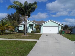 Building Photo - 4 BEDROOM - GATED TWIN LAKES SUBDIVISION -...