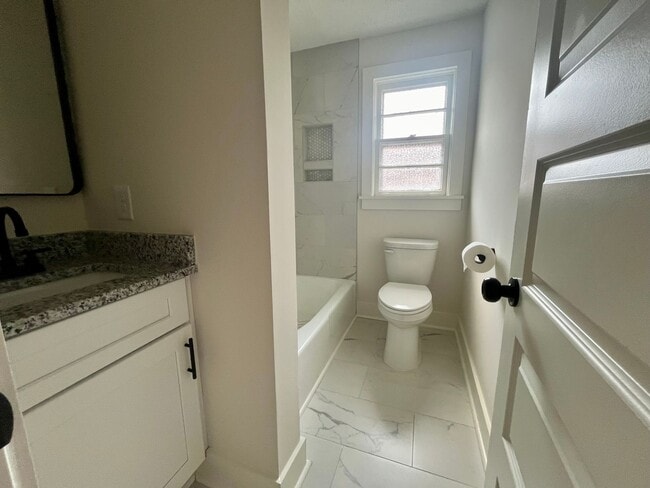 Building Photo - Fully Renovated 3BR/1.5BA – Prime Location + Lawn Care Included