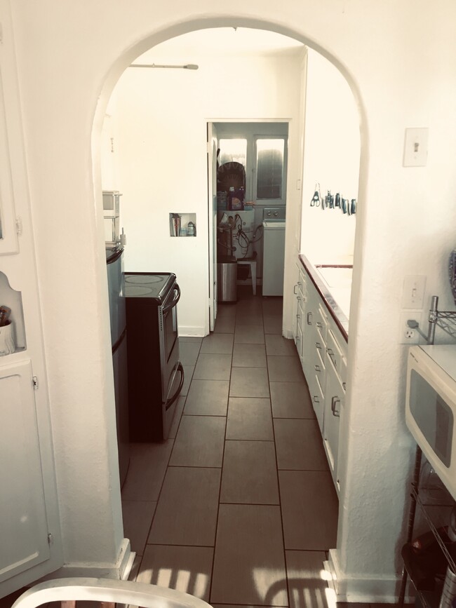 Kitchen leading to laundry room - 3438 Field Ave