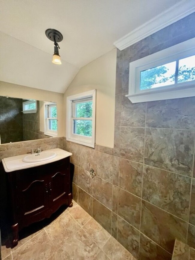 Building Photo - Introducing WesleyHeights401, a charming 3...