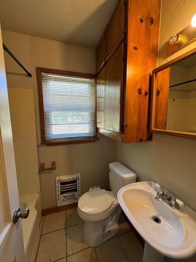 Building Photo - Mowing Included!  Lots of character, wood vinyl flooring and carpet, large, fenced yard, ready fo...