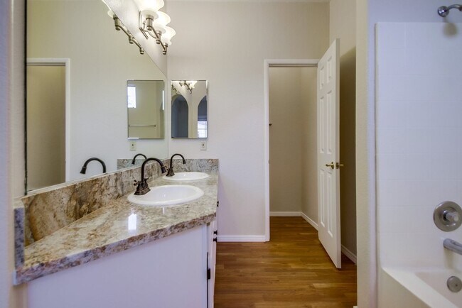 Building Photo - Spacious Townhome in San Marcos, 2-Car Garage, and a Tropical Community Pool!!