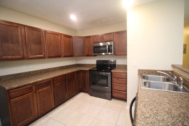 Building Photo - West Pensacola Duplex Living — 3BR Home with Open Floor Plan, Eat-In Kitchen, Covered Patio & Low...