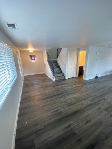 front room with down stairs 1/2 bath and coat closet - 17110 Waxwing Ct